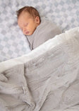 Checkered Silver Blanket featuring a gray checkered pattern and plush backing, perfect for cozy baby snuggles.