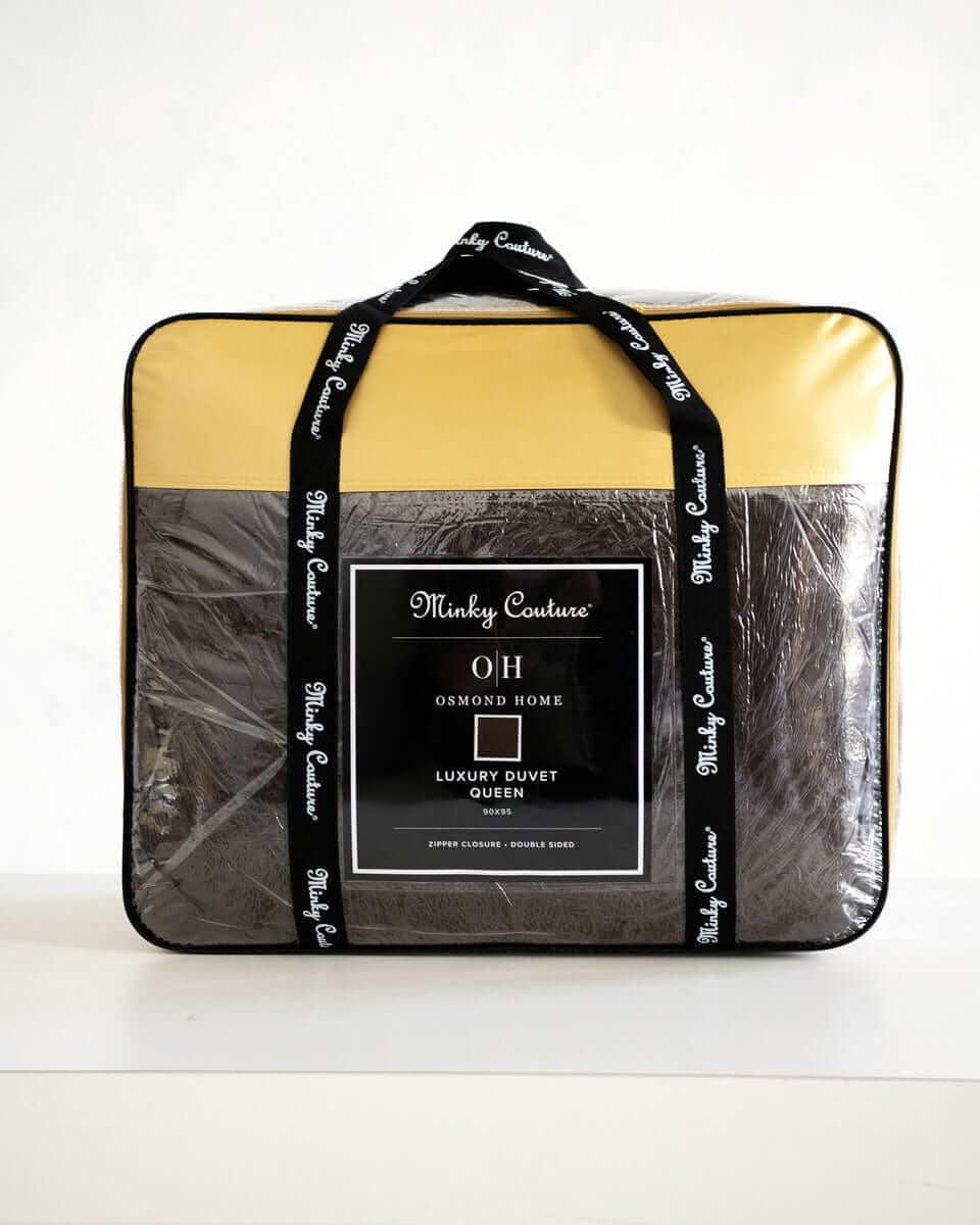 Chocolate Cloud Duvet packaged in plastic with yellow and black accents, showcasing Minky Couture branding.