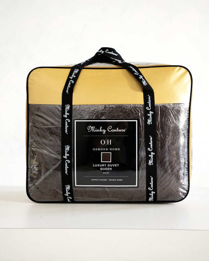 Chocolate Cloud Duvet packaged in plastic with yellow and black accents, showcasing Minky Couture branding.