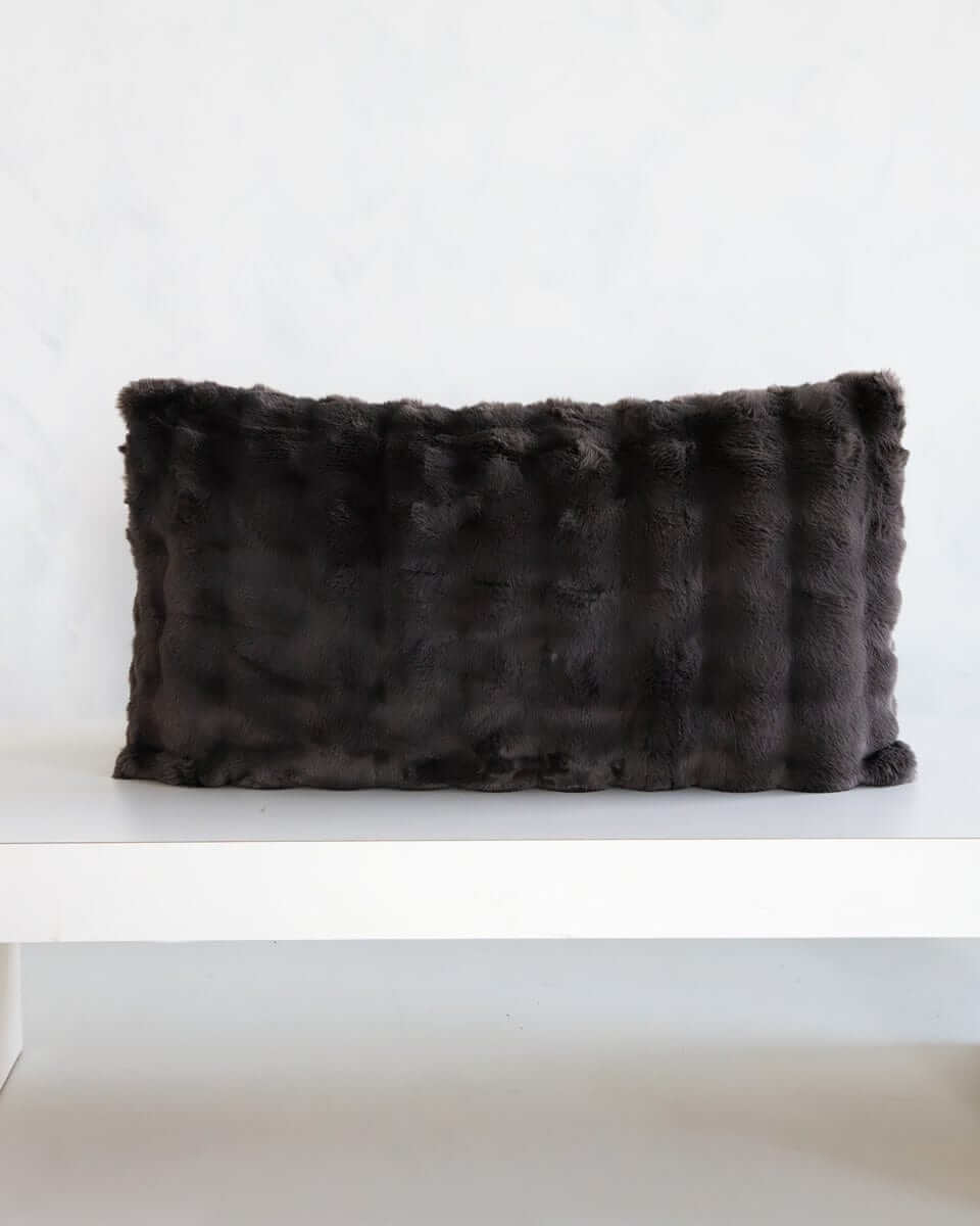 Charcoal Cloud Sham on a minimalist table, showcasing its plush fabric and elegant design for modern bedding.