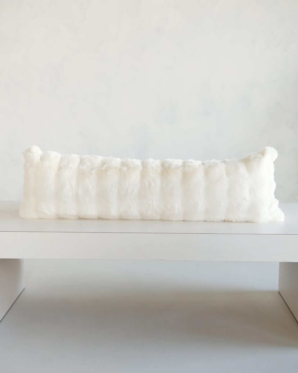 Cream Cloud Sham on a minimalist display surface, showcasing its plush texture and soft white color.