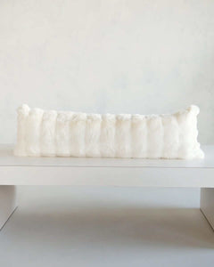 Cream Cloud Sham on a minimalist display surface, showcasing its plush texture and soft white color.