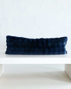 Navy Cloud Sham on a white table, showcasing its deep blue hue and ultra-soft plush fabric.