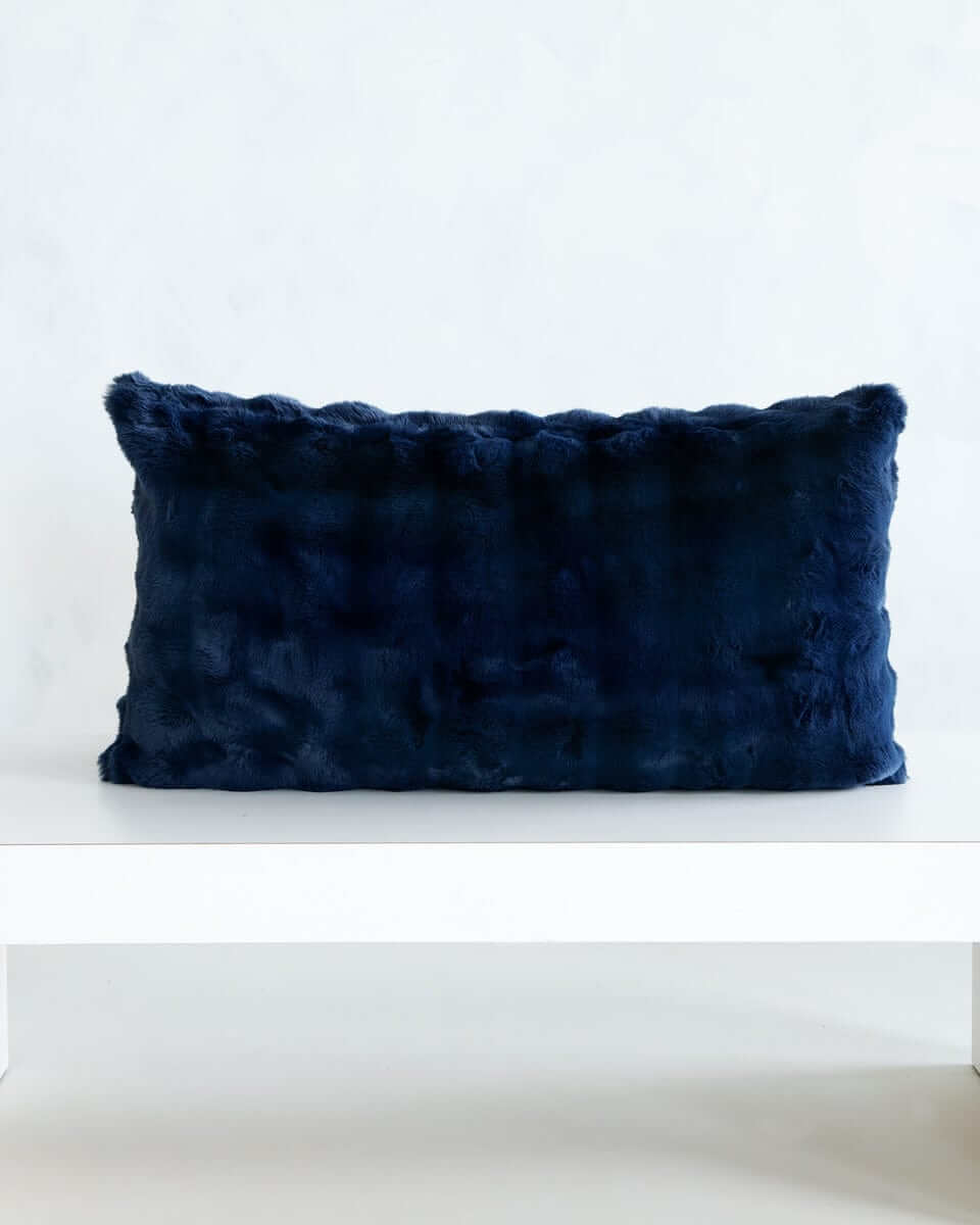 Navy Cloud Sham on a white surface, showcasing its plush deep blue fabric and elegant design.