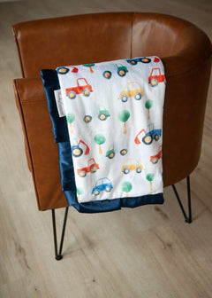 Cars Blanket featuring colorful cars and tractors on a soft minky fabric with navy satin ruffle.