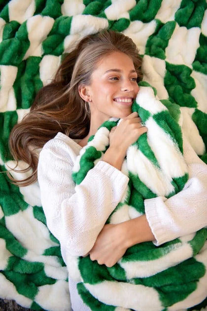 Woman wrapped in a green and white checkered Minky Couture Hugs Check Green.
