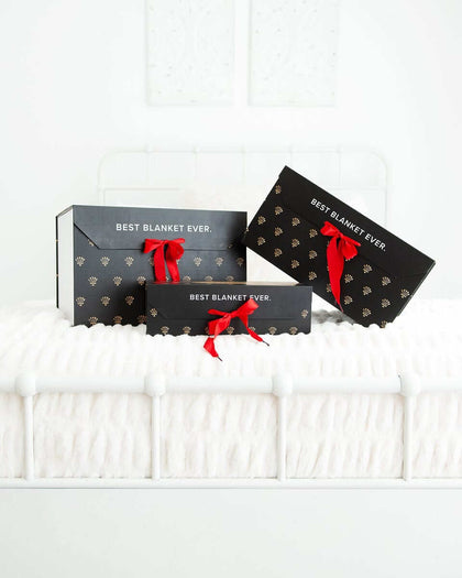 Gift Box featuring luxurious designs and red ribbons for the ultimate gifting experience.