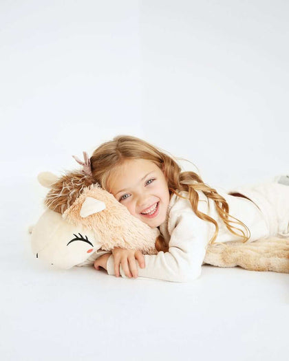 A happy child cuddling the Huggable Llama blanket, showcasing its adorable tan llama head and soft texture.