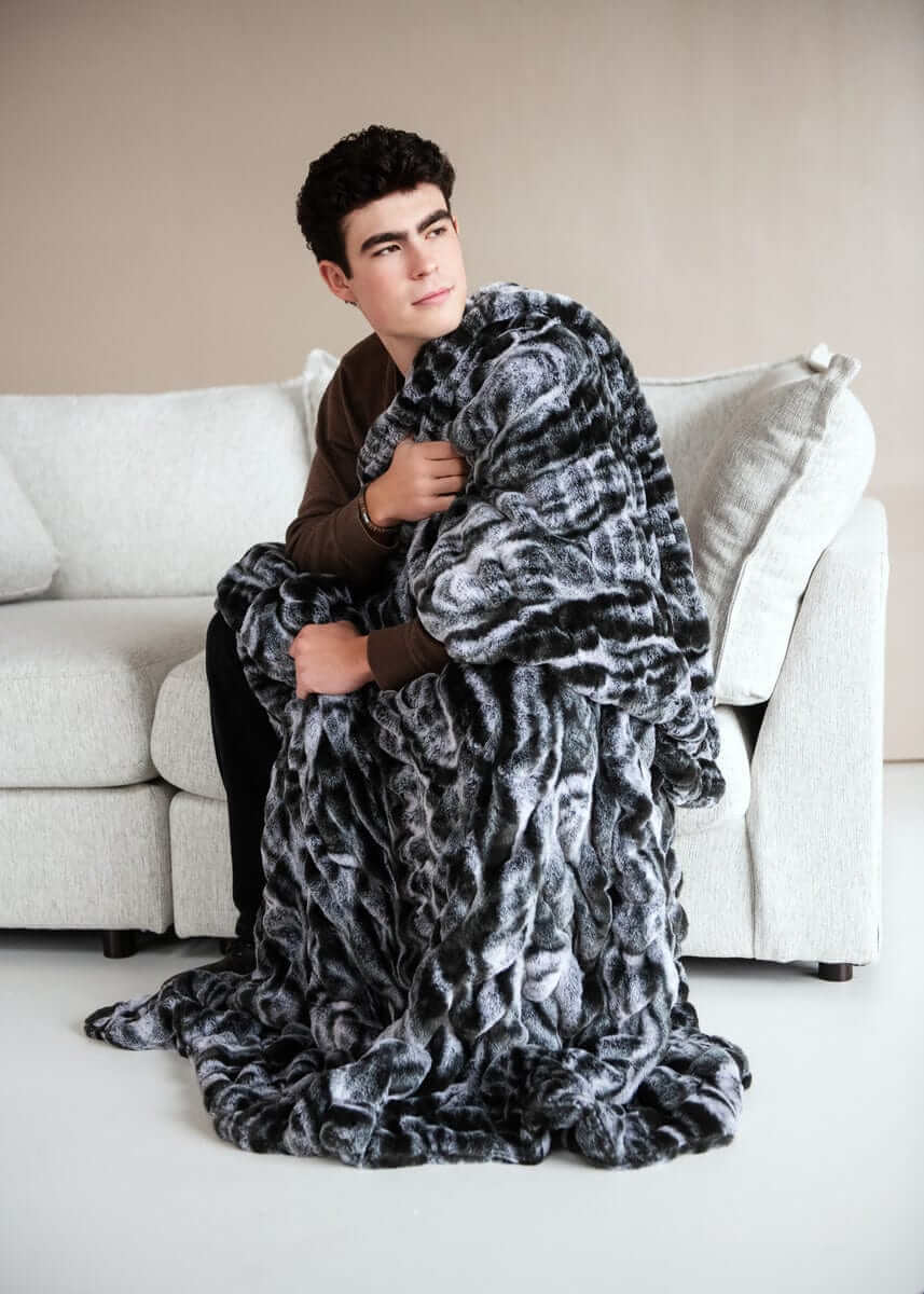 Cozy moments with the Hugs Marble Onyx Blanket, featuring a plush design and stylish marble print.