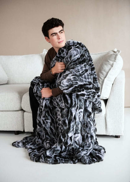 Cozy moments with the Hugs Marble Onyx Blanket, featuring a plush design and stylish marble print.