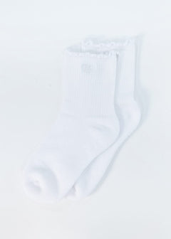 A pair of white ribbed crew socks with ruffled trim at the top, shown on a plain white background.