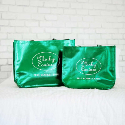 Reusable shopping Bag in green featuring Minky Couture logo, ideal for groceries and gifts.