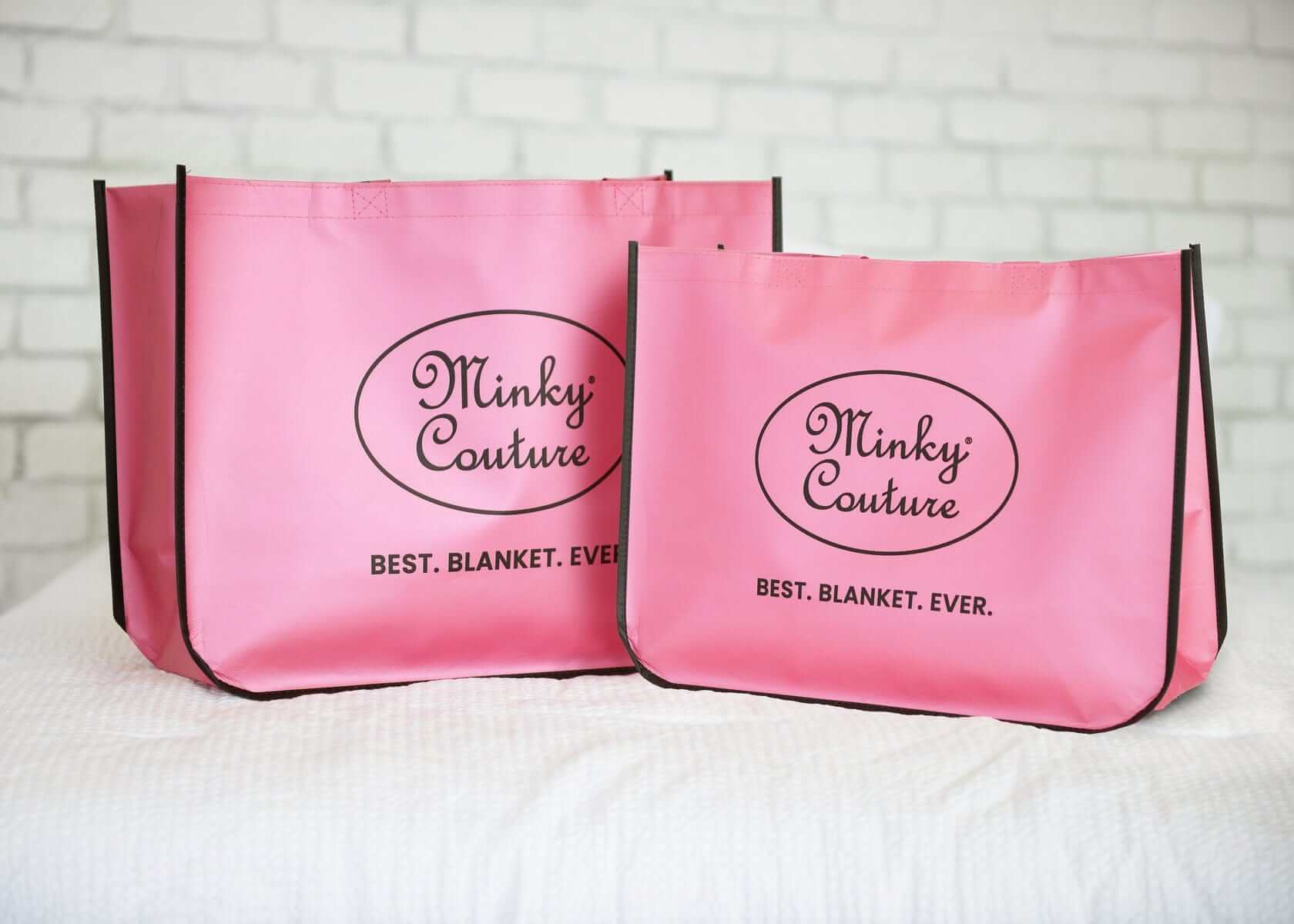 Two pink Minky Couture shopping bags showcasing the best in reusable shopping options.