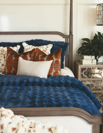 Navy Cloud Duvet draped over a bed with decorative pillows, creating a tranquil and sophisticated bedroom atmosphere.