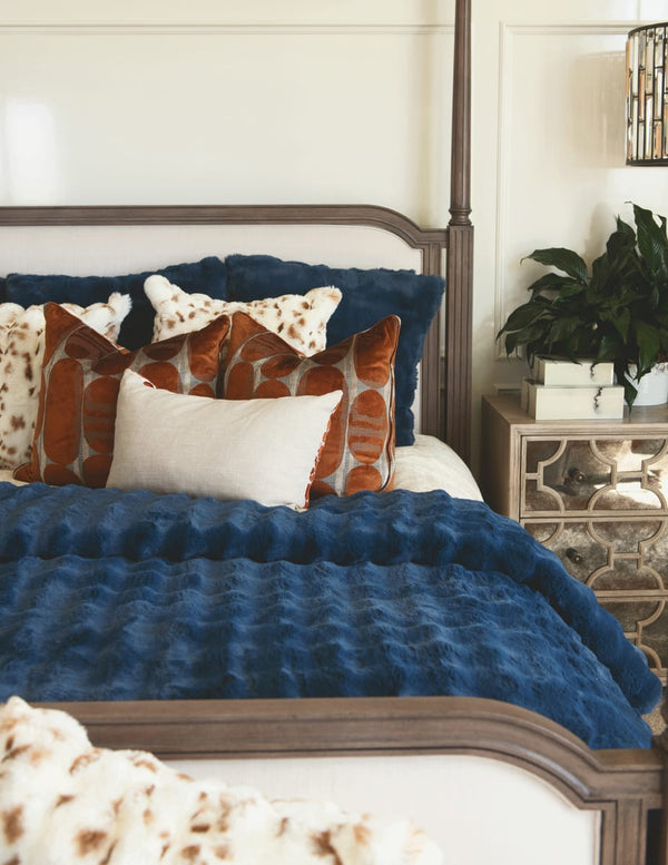 Navy Cloud Duvet draped over a bed with decorative pillows, creating a tranquil and sophisticated bedroom atmosphere.