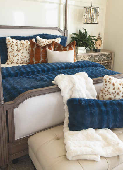 Navy Cloud Sham on a bed, featuring a luxurious deep blue hue and plush fabric, perfect for elegant décor.