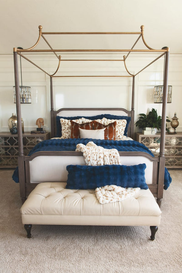 Stylish bedroom featuring Navy Cloud Sham on a luxurious canopy bed with elegant cushions and a plush bench.