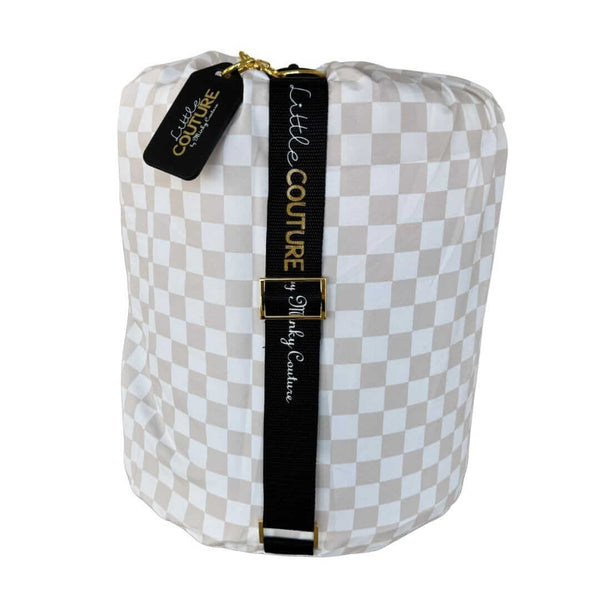 Beige and white checkered baby Oat Check sleeping bag Little Couture strap and gold hardware.