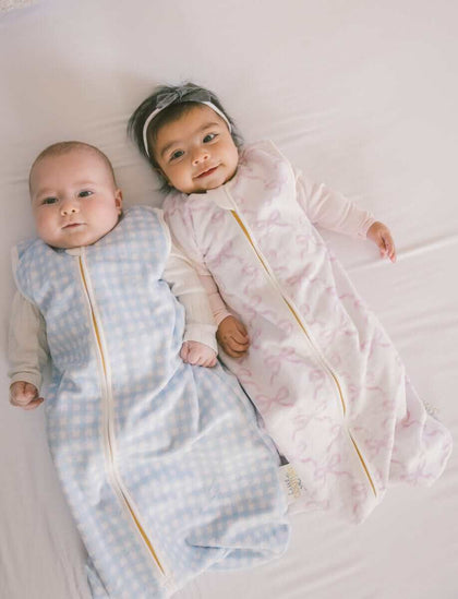  Minky Couture Wearable Blankets on two infants, one in pink, one in blue, showcasing cozy sleep options.