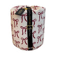 Red ribbon bows baby sleeping bag rolled with black Little Couture strap and gold hardware.