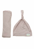 Swaddle and Hat Blush combo featuring a soft bamboo swaddle and matching hat for babies.