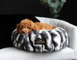 Cozy dog lounging in a Cloudy Day Black Pet Bed made with orthopedic memory foam and Minky Couture fabric.