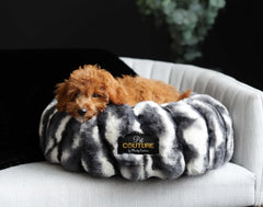 Cozy dog lounging in a Cloudy Day Black Pet Bed made with orthopedic memory foam and Minky Couture fabric.