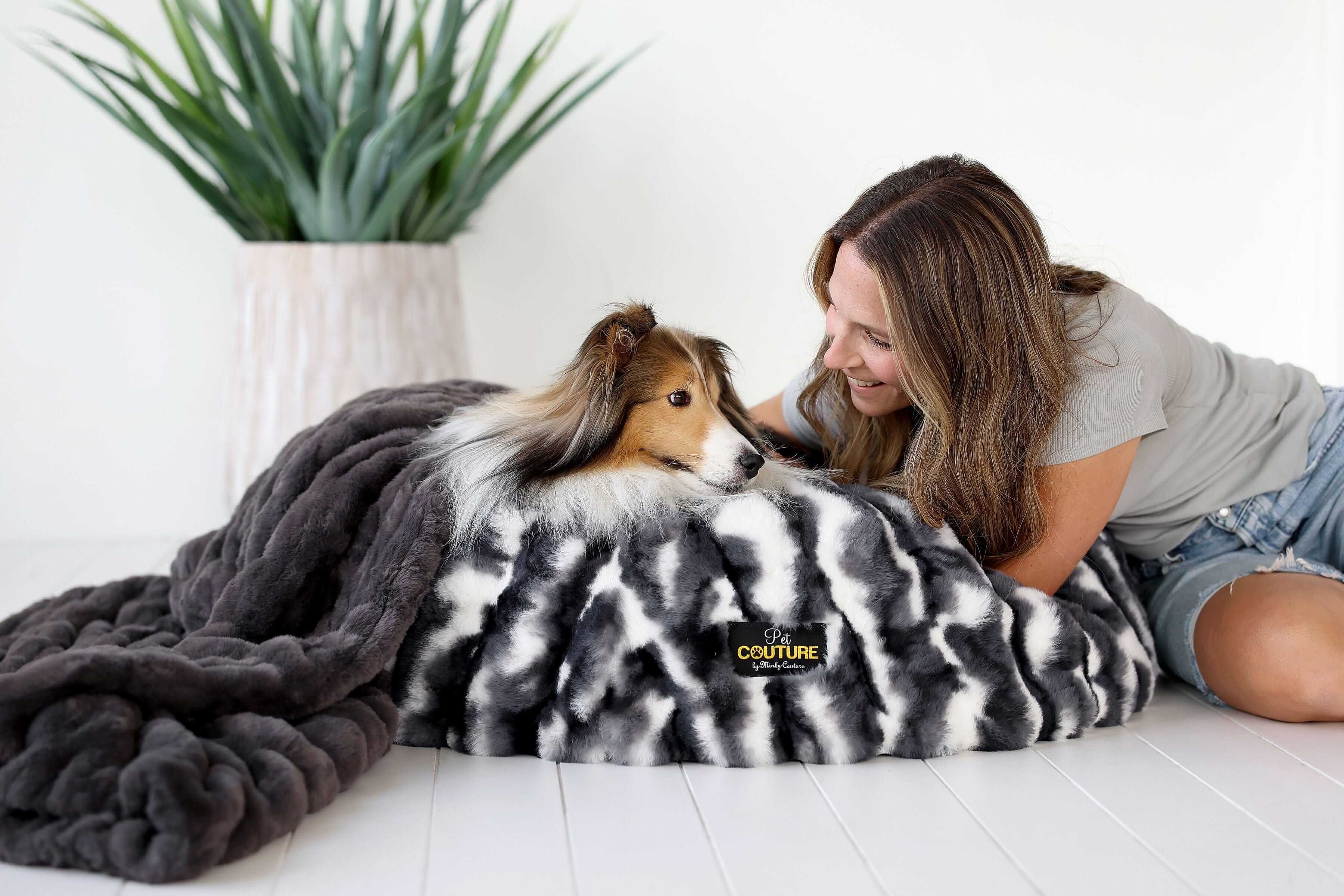 Cloudy Day Black Pet Bed with a dog and owner, showcasing comfort and style in a cozy space.