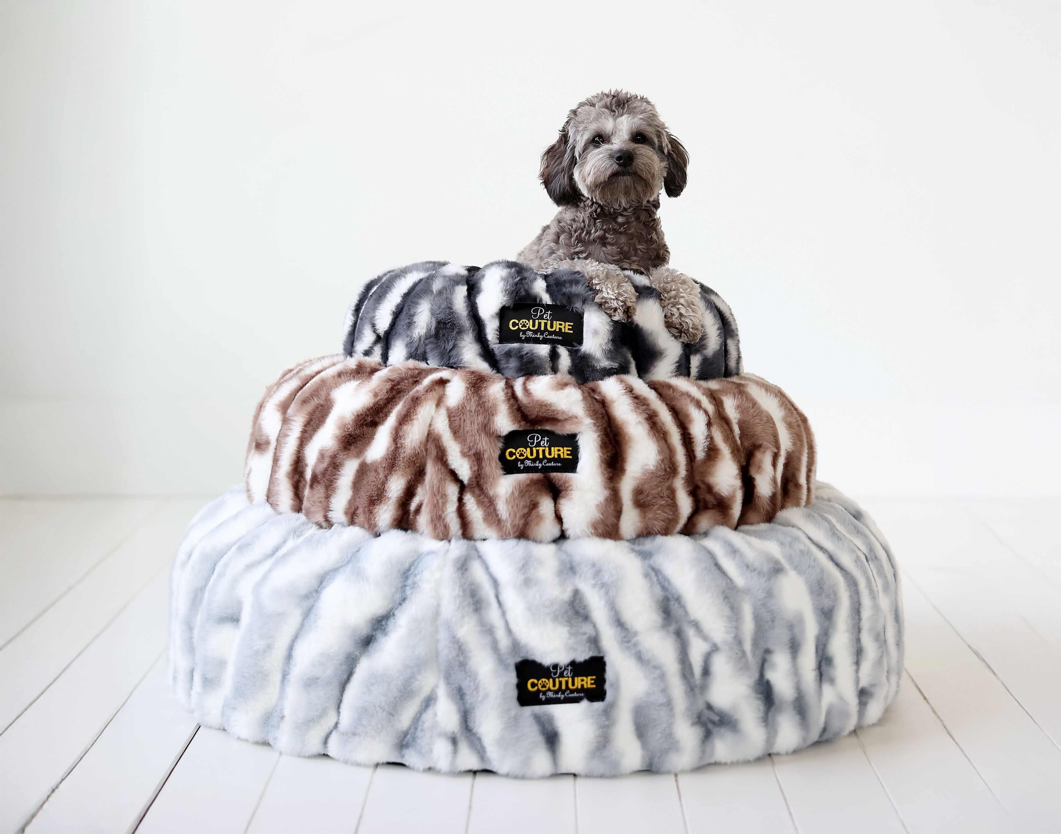 Cloudy Day Brown Pet Bed featuring a cozy dog sitting on a stylish fuzzy bed stacked three layers high.