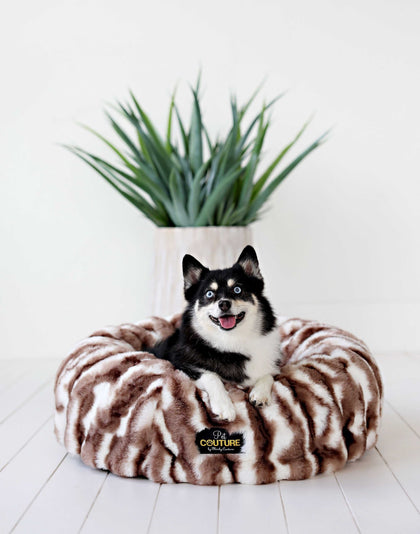 Cloudy Day Brown Pet Bed featuring a happy dog lounging inside a cozy round bed with a stylish design.