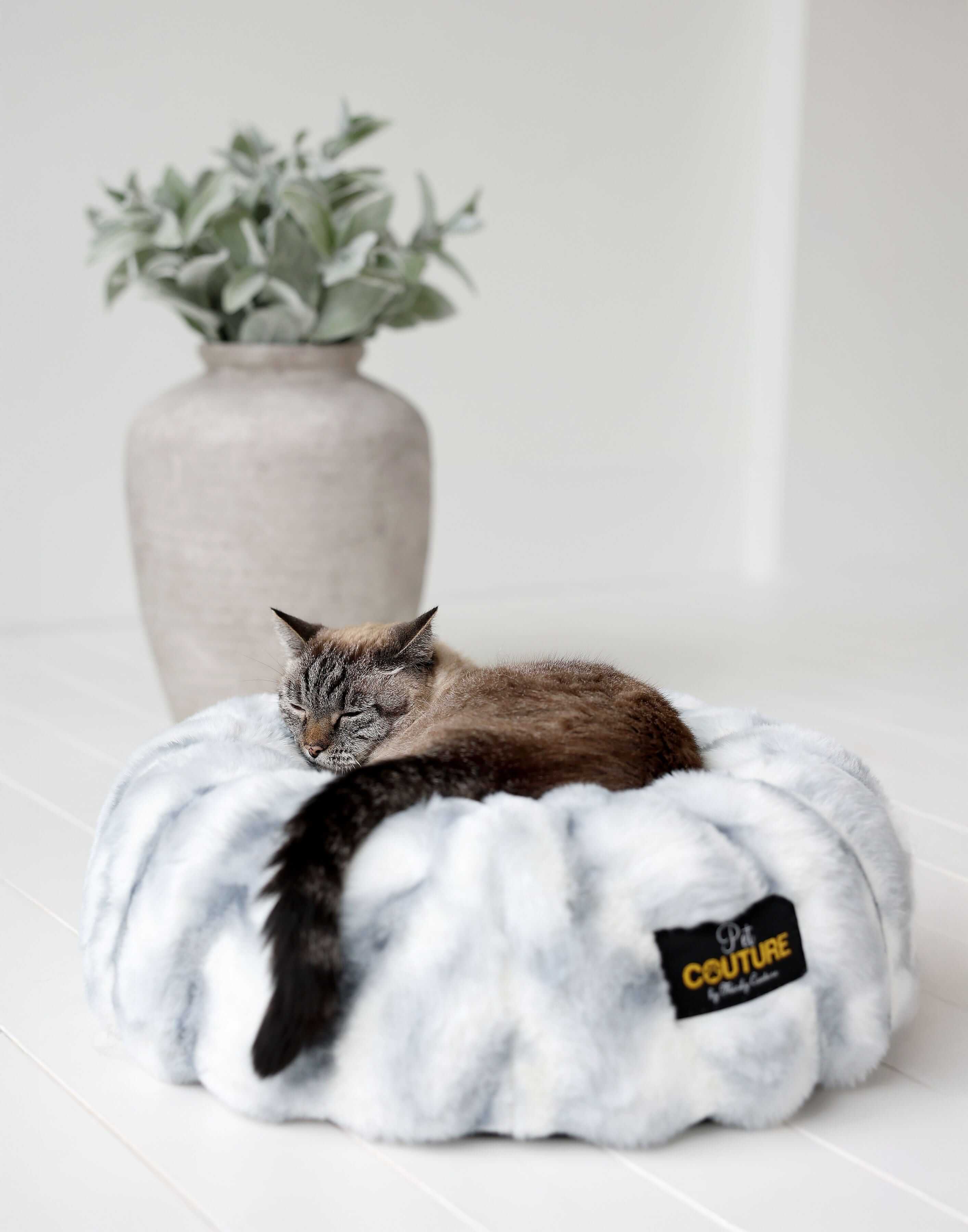 Cloudy Day Blue Pet Bed with a cozy cat nestled inside, featuring soft Minky Couture fabric for ultimate comfort.
