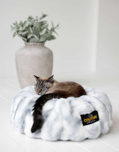 Cloudy Day Blue Pet Bed with a cozy cat nestled inside, featuring soft Minky Couture fabric for ultimate comfort.