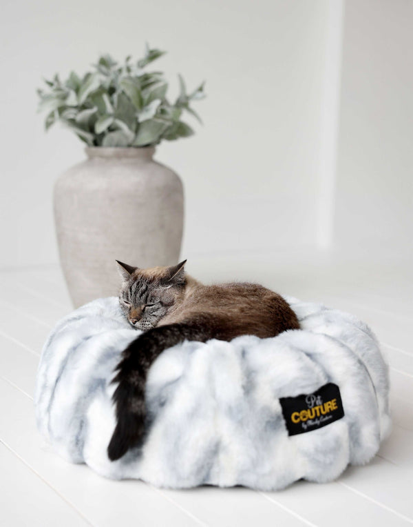 Cloudy Day Blue Pet Bed with a cozy cat nestled inside, featuring soft Minky Couture fabric for ultimate comfort.