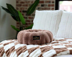 Minky Couture Milk Chocolate Pet Bed on a cozy blanket with a stylish design, perfect for pet comfort and relaxation.