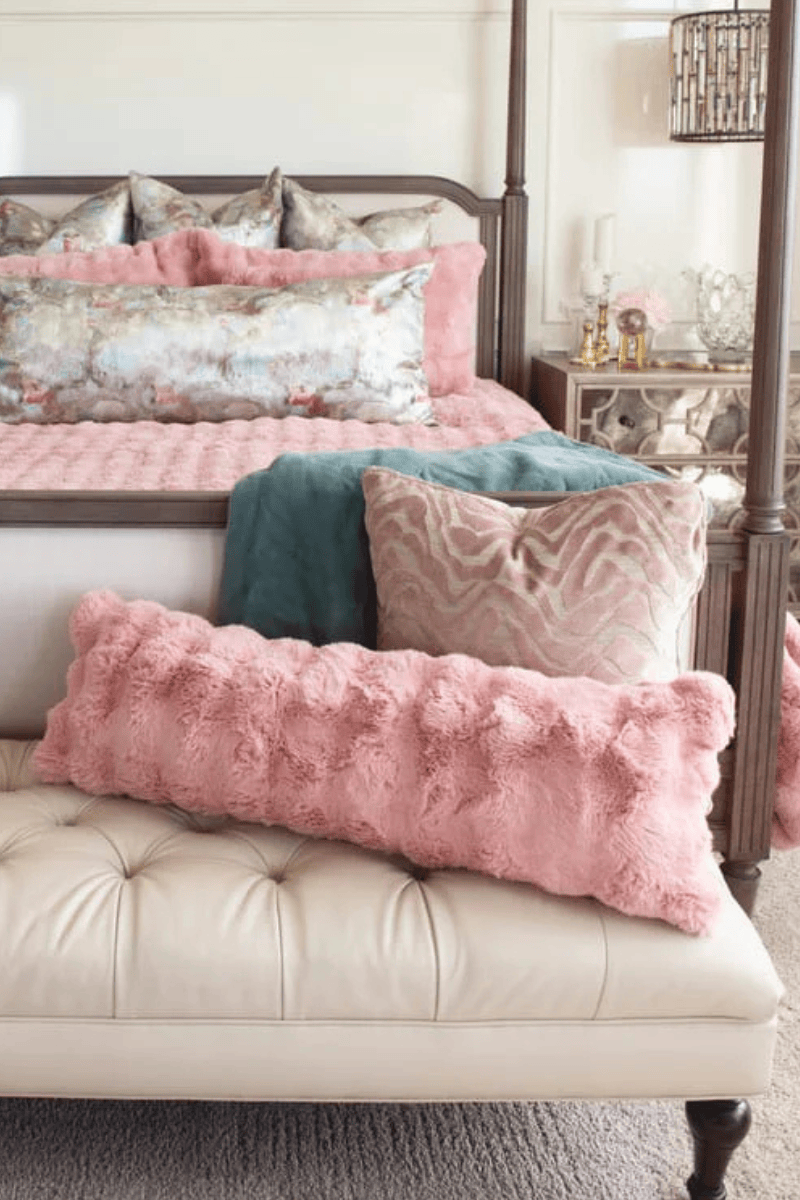 Ballet Rose Cloud Sham among plush pillows on a stylish bed, adding elegance and comfort to the bedroom decor.