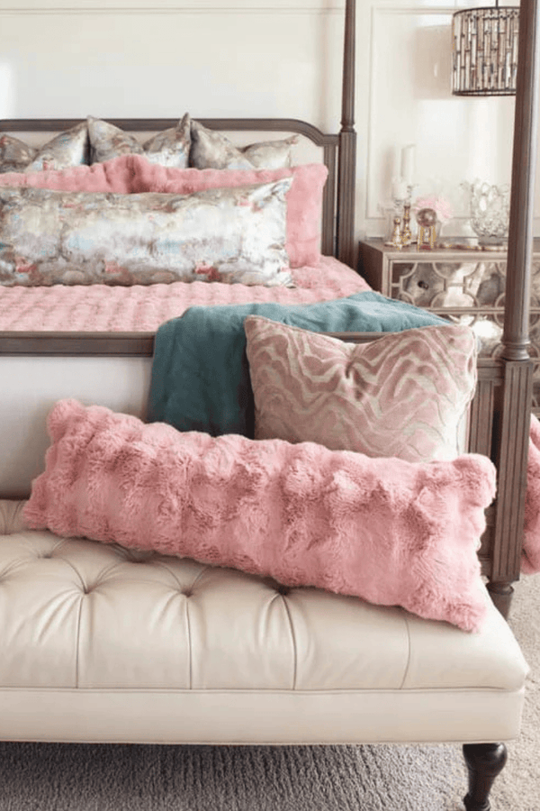 Ballet Rose Cloud Sham among plush pillows on a stylish bed, adding elegance and comfort to the bedroom decor.
