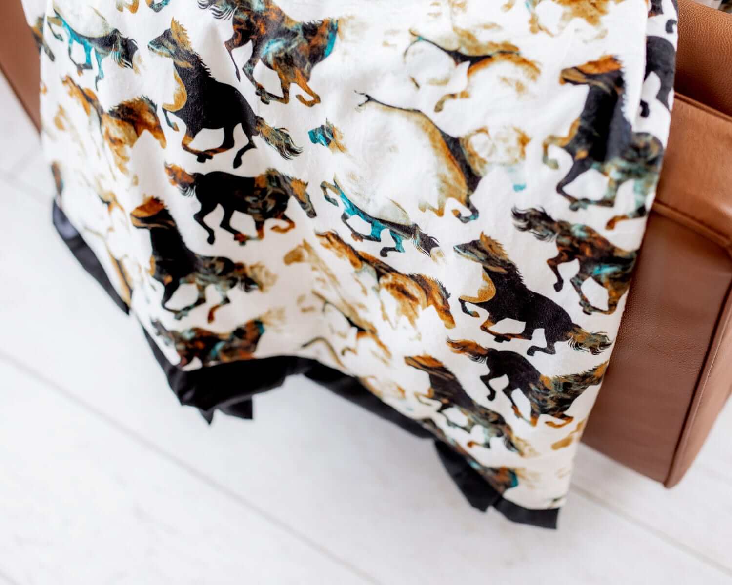 Stallion Blanket featuring watercolor horses on a cream background, perfect for western themed decor.