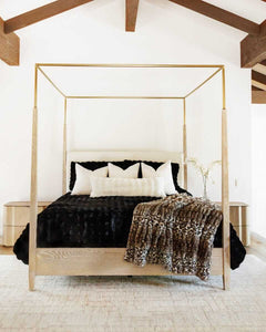 Luxurious Black Cloud Duvet on a stylish canopy bed, enhancing the modern bedroom decor with softness and elegance.
