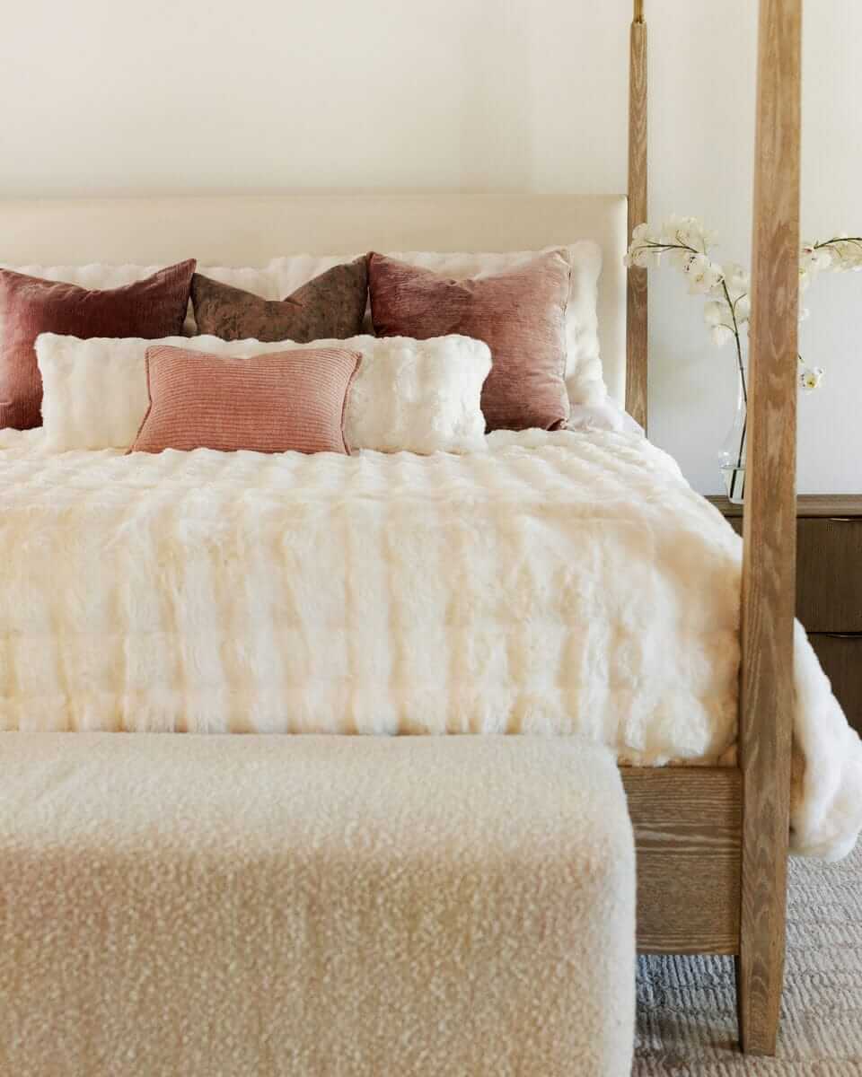 Cream Cloud Sham on a beautifully styled bed with plush pillows and a textured throw.