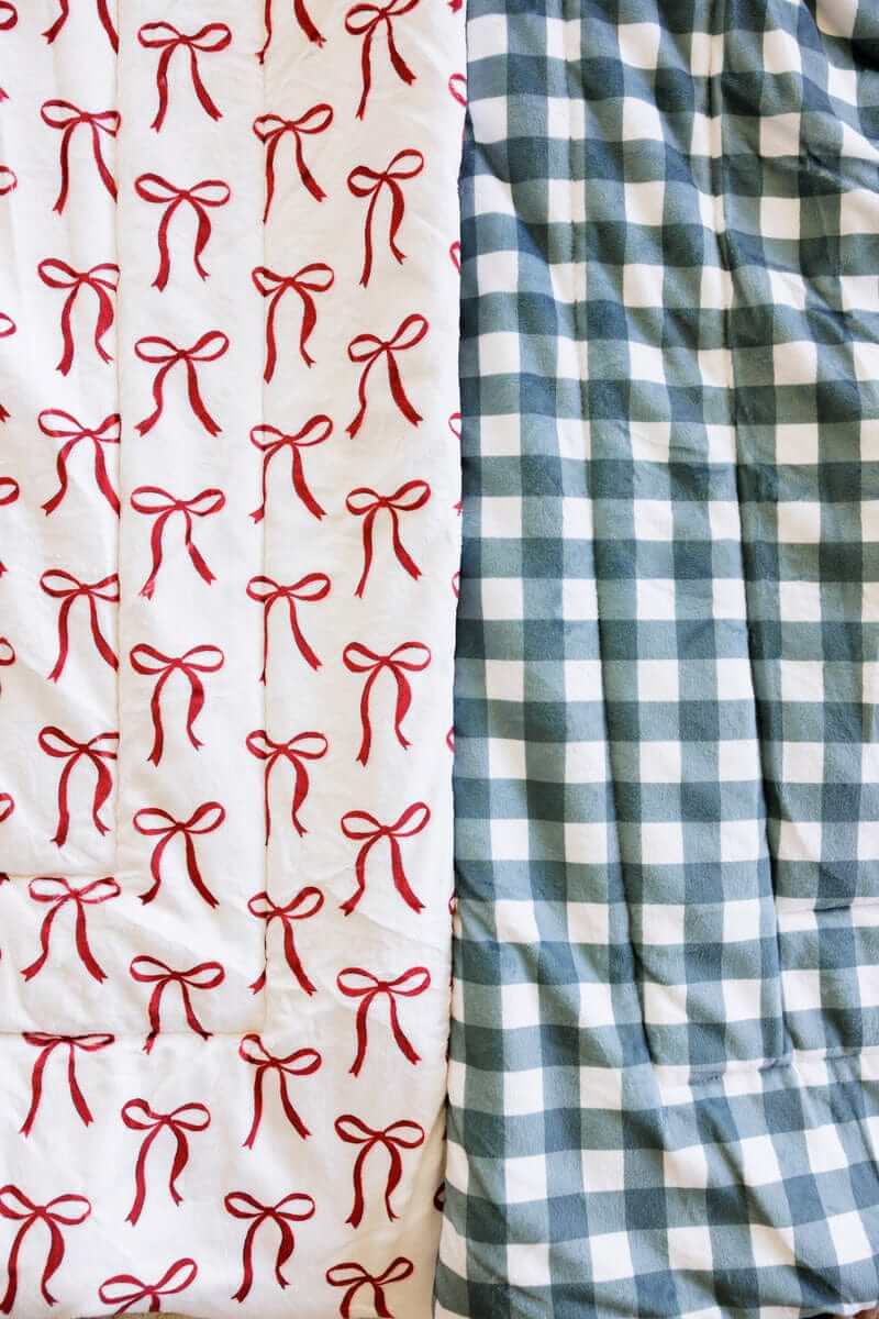 Red bow and balsam gingham Minky Couture Sleeping Bags close-up.