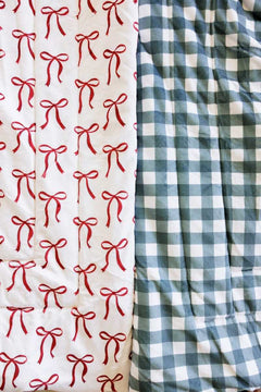 Red bow and balsam gingham Minky Couture Sleeping Bags close-up.