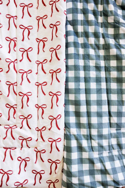 Red bow and balsam gingham Minky Couture Sleeping Bags close-up.