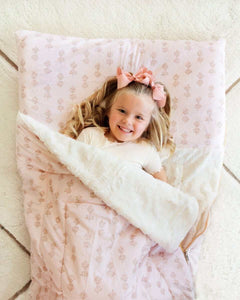 Girl with pink bows under a pink floral Minky Couture Hampton Blooms Sleeping Bag-