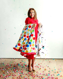 Minky Couture Happy Birthday Blanket displayed by a smiling woman, surrounded by colorful confetti.