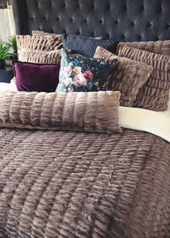 Bed with textured Minky Couture Hugs Milk Chocolate bedding and shams.