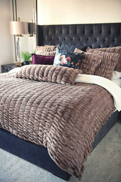 Hugs Milk Chocolate Minky Couture duvet styled on a bed.