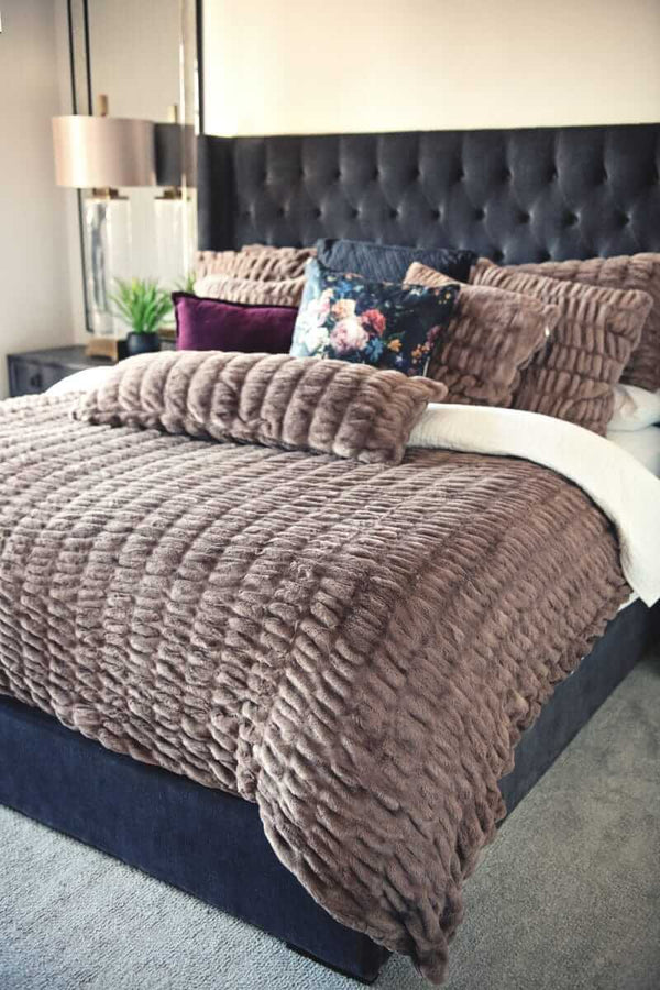 Hugs Milk Chocolate Minky Couture duvet styled on a bed.