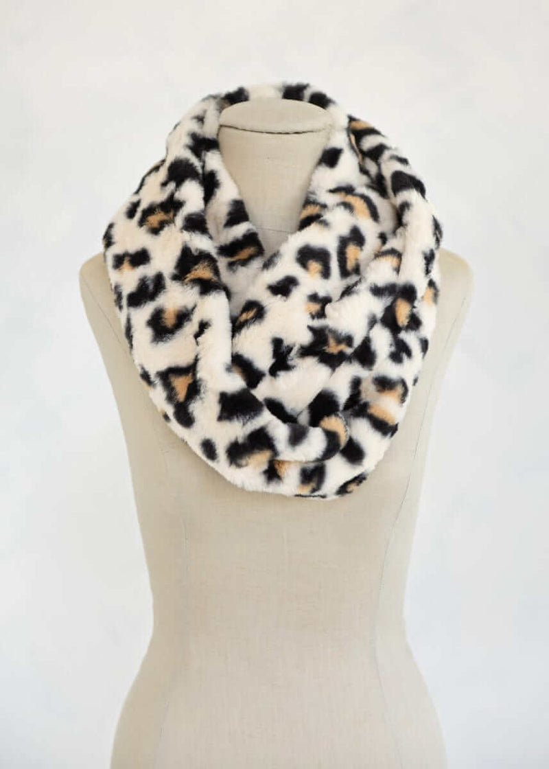 Lush Scarf in Leo Cream leopard print featuring a cozy, plush design, perfect for stylish warmth on chilly days.