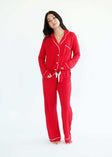 Woman wearing Red Middle of the Night Pajamas, a stylish button-up set with long sleeves and a high waisted bottom.