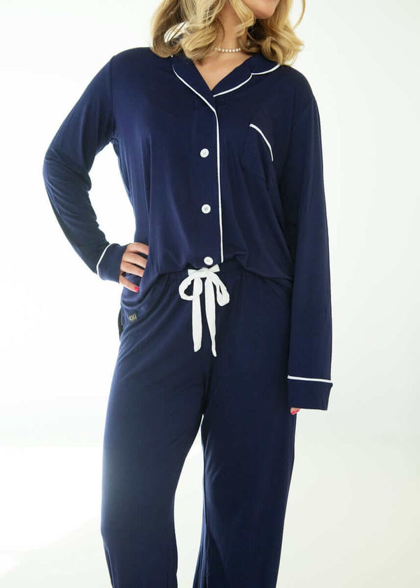 Model wearing Middle of the Night Pajamas in Navy Evening Blue, featuring a button-up top and straight-leg pants.